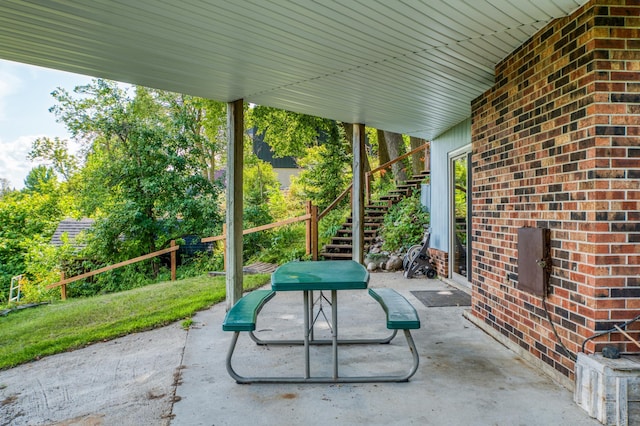 view of patio featuring stairway