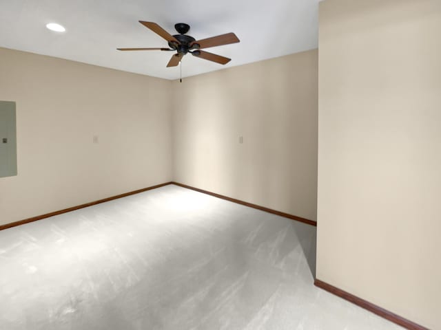 spare room with light carpet, ceiling fan, baseboards, and recessed lighting