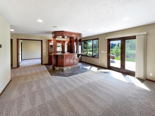 2464 Tournament Players Cir N, Blaine, MN 55449 - unfurnished living room with light colored carpet, a textured ceiling, baseboards, and recessed lighting