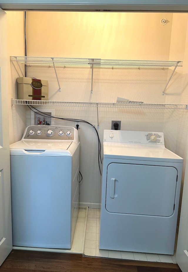 laundry room featuring washer and dryer and laundry area