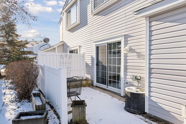 view of home's exterior featuring a patio and fence