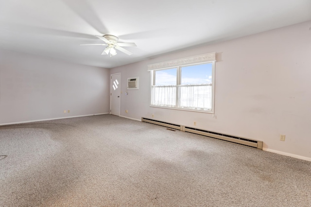 unfurnished room featuring a baseboard heating unit, carpet floors, a ceiling fan, and baseboards