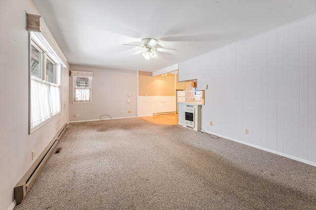 unfurnished living room featuring ceiling fan, a baseboard radiator, carpet flooring, baseboards, and baseboard heating