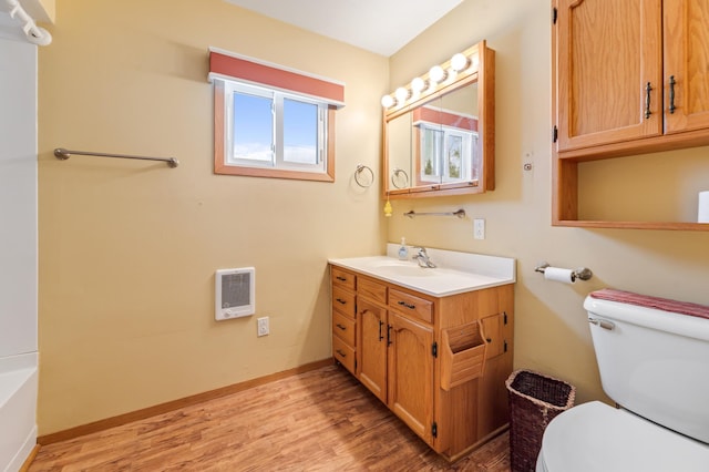 full bath featuring baseboards, vanity, toilet, and wood finished floors