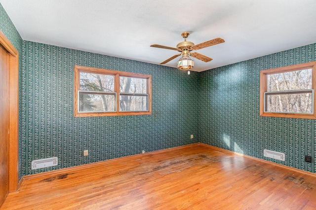 13197 132nd St W, Apple Valley, MN 55124 - spare room with wood finished floors, ceiling fan, and baseboards