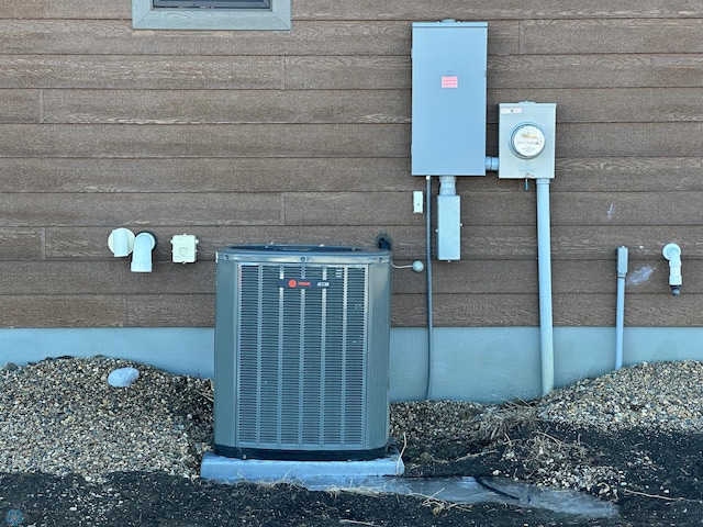 details featuring electric meter and central AC unit