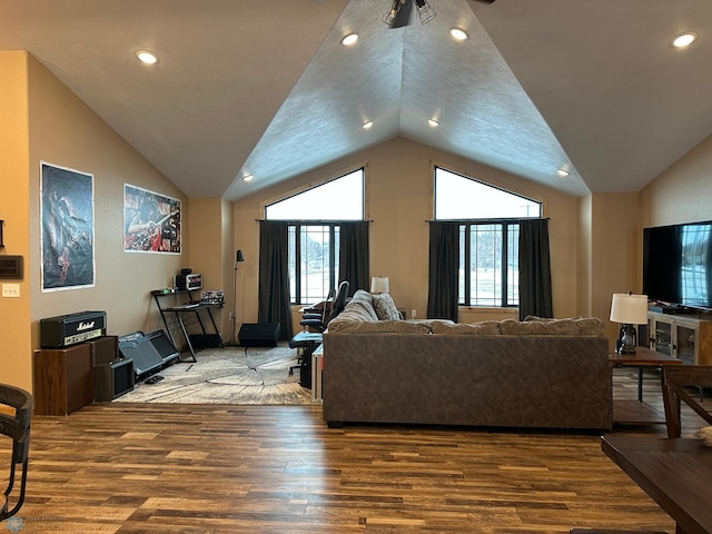 living area with recessed lighting, vaulted ceiling, and wood finished floors