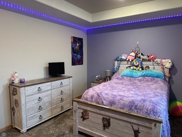 bedroom with dark carpet