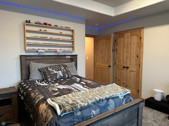 carpeted bedroom with a closet