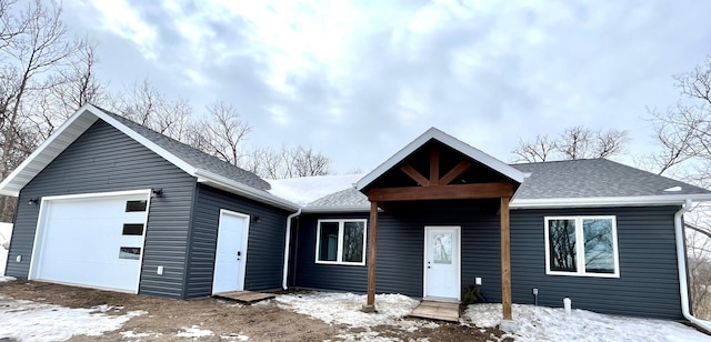 view of front of property with a shingled roof