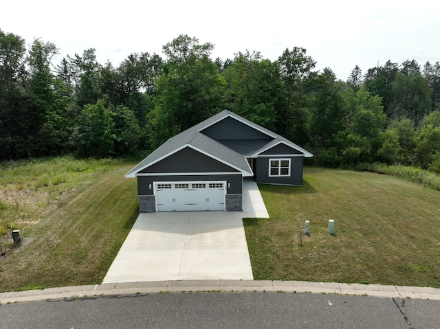 craftsman-style house featuring a garage, stone siding, concrete driveway, and a front yard