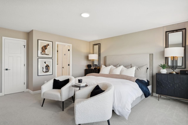 bedroom featuring recessed lighting, light colored carpet, and baseboards