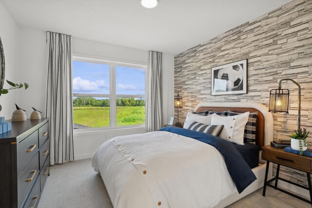 bedroom featuring light carpet