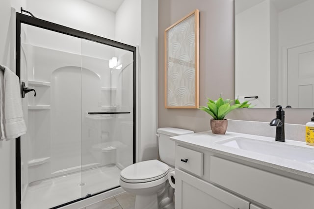 full bathroom with tile patterned flooring, a shower stall, toilet, and vanity