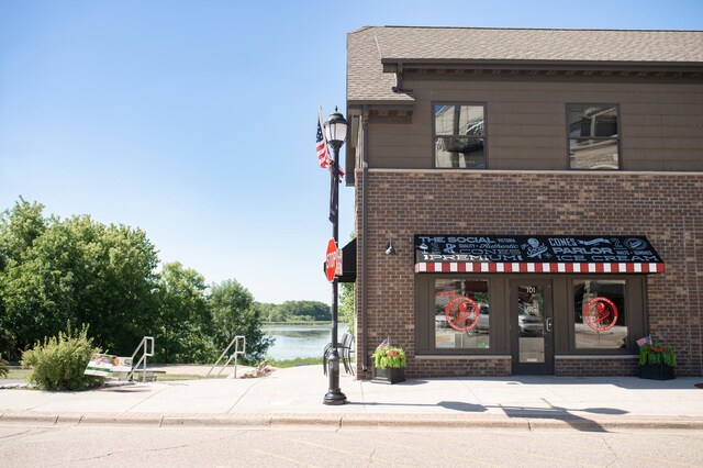 view of building exterior featuring a water view