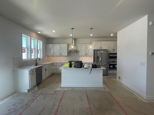 kitchen featuring white cabinets, wall chimney range hood, baseboards, and stainless steel appliances