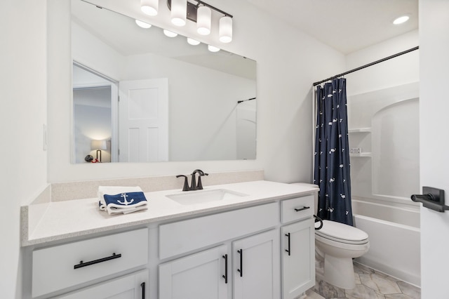 bathroom featuring toilet, marble finish floor, shower / tub combo, and vanity