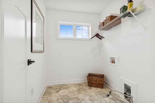 laundry room featuring hookup for a washing machine, laundry area, and baseboards