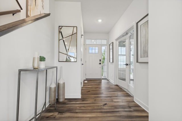 foyer entrance featuring recessed lighting, baseboards, and dark wood-style flooring