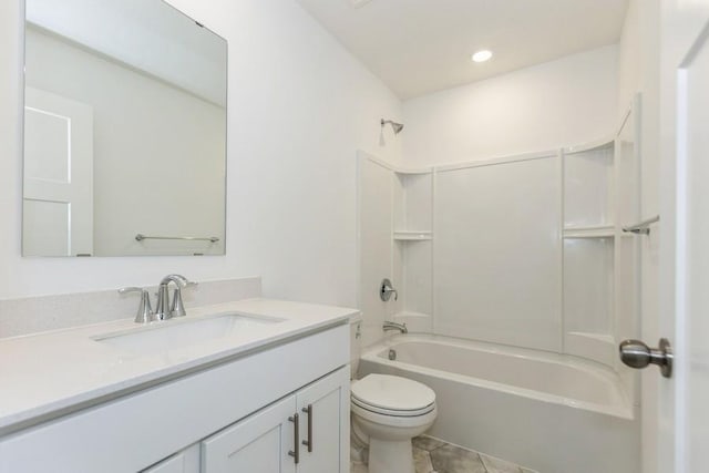 full bath featuring toilet, tile patterned flooring, vanity, and washtub / shower combination