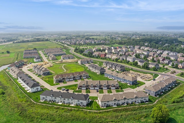 birds eye view of property with a residential view