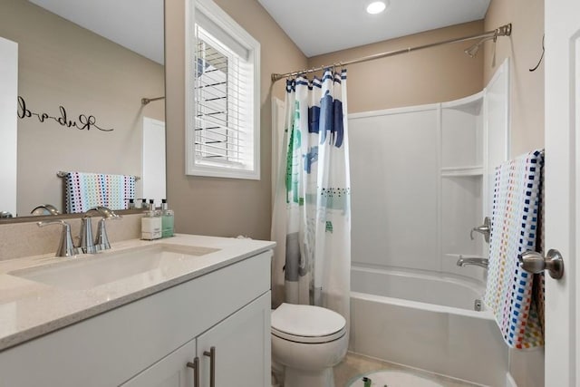 full bath featuring shower / bath combo, vanity, and toilet