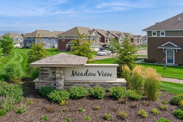 community / neighborhood sign featuring a residential view