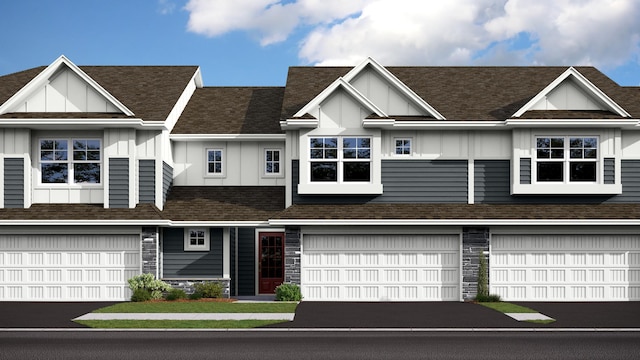 multi unit property featuring driveway, stone siding, roof with shingles, board and batten siding, and an attached garage