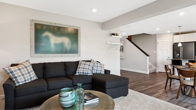 living area featuring stairway, recessed lighting, baseboards, and dark wood-style flooring