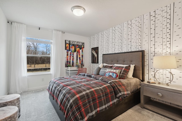 carpeted bedroom featuring baseboards