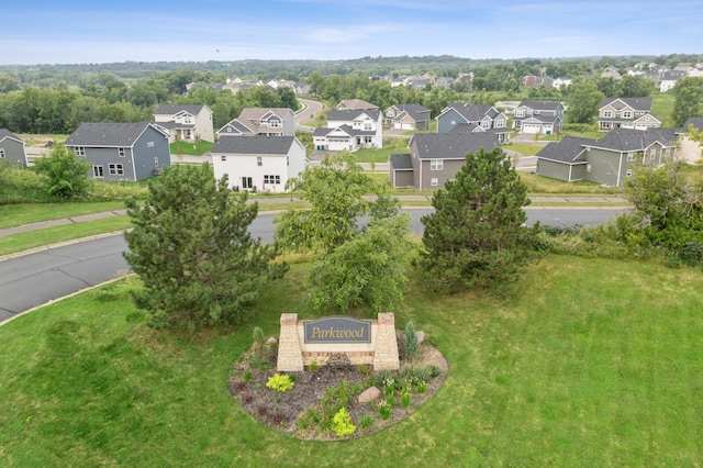 birds eye view of property with a residential view