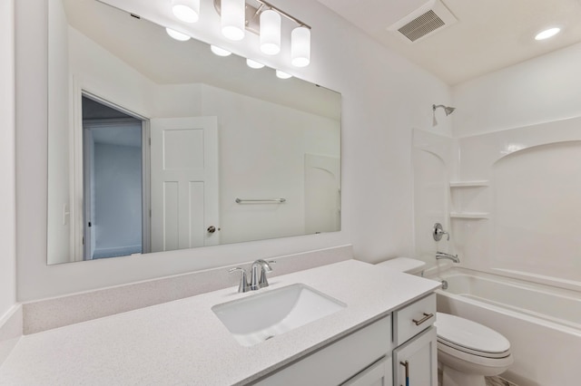 bathroom with toilet, visible vents, shower / washtub combination, and vanity