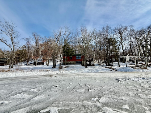 view of yard layered in snow