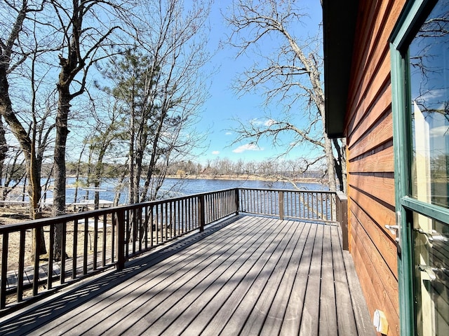 wooden deck featuring a water view