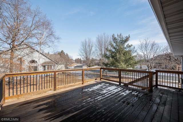 wooden terrace featuring a residential view