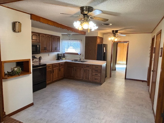 kitchen with light floors, open shelves, light countertops, a sink, and black appliances