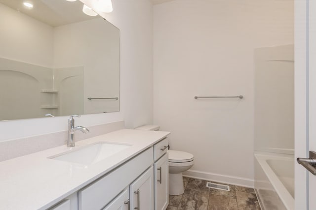 bathroom with baseboards, visible vents, vanity, and toilet