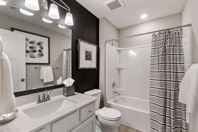 full bath featuring toilet, visible vents, shower / bath combo with shower curtain, and vanity