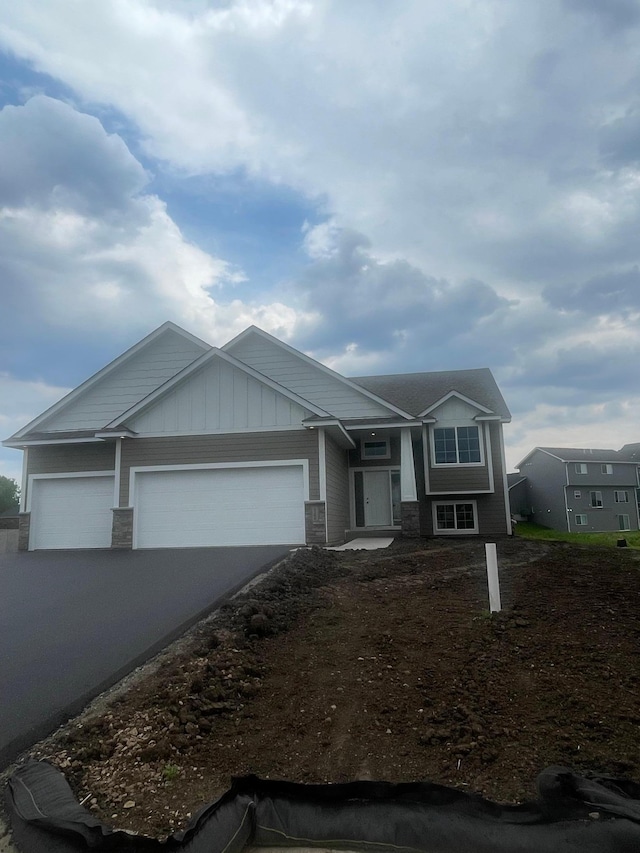 5266 177th St W, Lakeville, MN 55024 - view of front of property featuring a garage, driveway, and stone siding