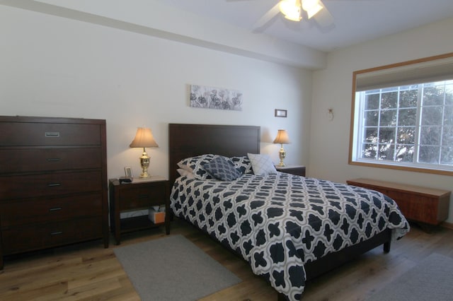 bedroom with ceiling fan and wood finished floors