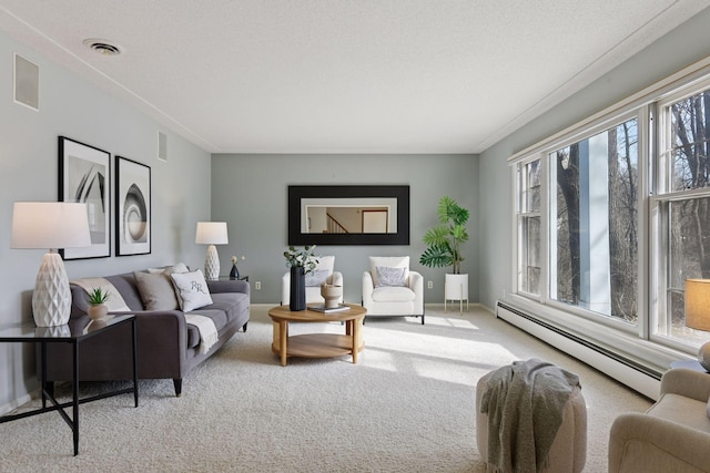 carpeted living room featuring visible vents, baseboard heating, and a textured ceiling