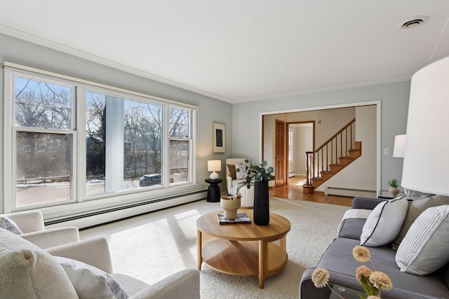 living area with a baseboard heating unit, crown molding, stairs, and wood finished floors