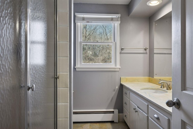 full bathroom with a baseboard radiator, an enclosed shower, and vanity