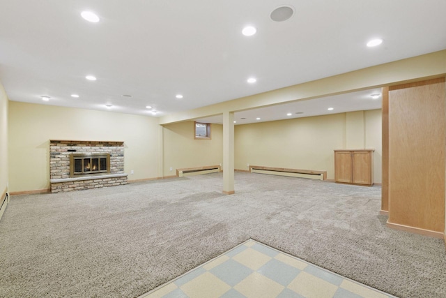 finished basement featuring carpet flooring, recessed lighting, and baseboard heating