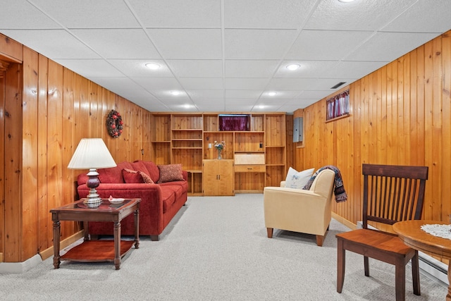 living area featuring carpet floors, wooden walls, and recessed lighting