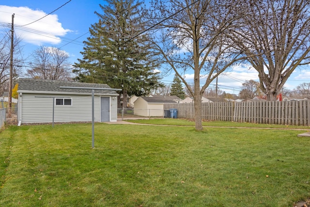 view of yard with a fenced backyard and an outdoor structure