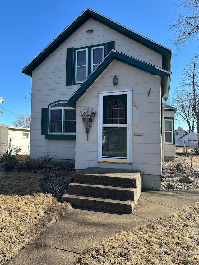 bungalow-style house featuring entry steps