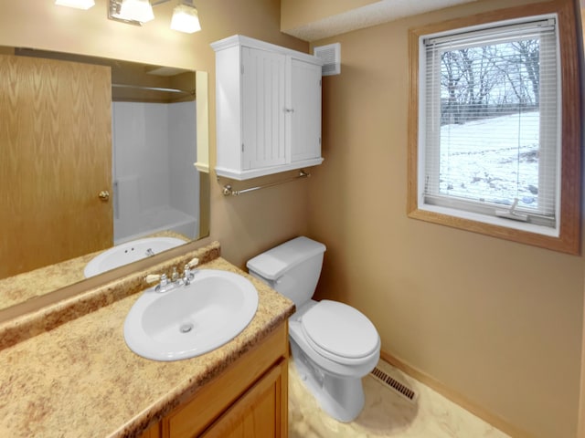 full bathroom featuring toilet, vanity, walk in shower, and visible vents