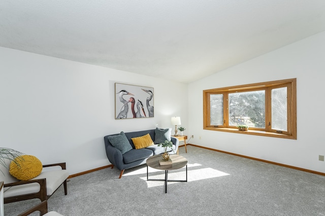 living room featuring baseboards, carpet floors, and vaulted ceiling