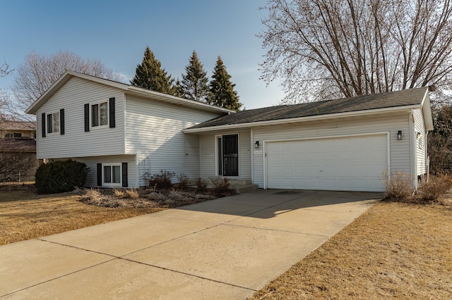 split level home featuring a garage and driveway